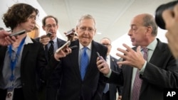 Senate Majority Leader Mitch McConnell, R-Ky., is surrounded by reporters as Republicans work to pass their tax bill, on Capitol Hill in Washington, Nov. 30, 2017.