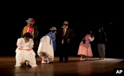 In this April 30, 2019 photo, members of the "Kory Warmis," or Women of Gold theater group, perform at the Municipal Theater, in La Paz, Bolivia.