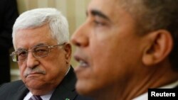 U.S. President Barack Obama meets with Palestinian Authority President Mahmoud Abbas (L) at the White House in Washington March 17, 2014. President Obama on Monday urged Palestinian President Mahmoud Abbas to make tough decisions and take risks for peace 