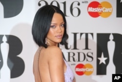 Singer Rihanna poses for photographers upon arrival for the Brit Awards 2016 at the 02 Arena in London, Feb. 24, 2016.