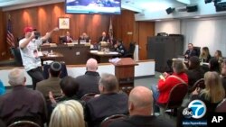 In this March 19, 2018 image made from video provided by KABC-7, council members listen during a meeting in Los Alamitos, California. Leaders of the small California city of 12,000 people voted this week to exempt it from California's sanctuary law.