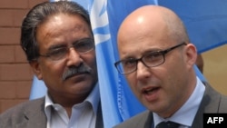 FILE - Robert Piper, (r) then-United Nations Resident Coordinator For Nepal, is shown in Kathmandu on April 24, 2008. 
