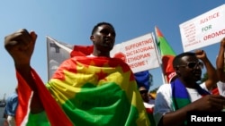 FILE - Ethiopian migrants, all members of the Oromo community of Ethiopia living in Malta, protest against the Ethiopian regime.