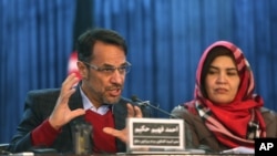 Ahmad Fahim Hakim, left, a member of the Afghan People's Dialogue on Peace Initiative addresses a press conference in Kabul, Afghanistan, Jan. 9, 2016. Afghanistan, Pakistan, China and the United States will hold talks in Islamabad on Monday aimed at reviving the Afghan peace process.