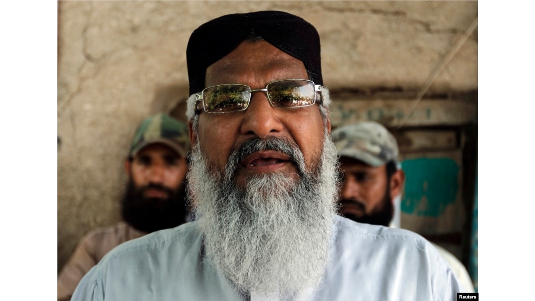 FILE - Radical Sunni cleric Mohammad Ahmed Ludhianvi addresses his supporters during his election campaign in Jhang, Punjab province, April 16, 2013.
