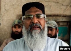 FILE - Radical Sunni cleric Mohammad Ahmed Ludhianvi addresses his supporters during his election campaign in Jhang, Punjab province, April 16, 2013.