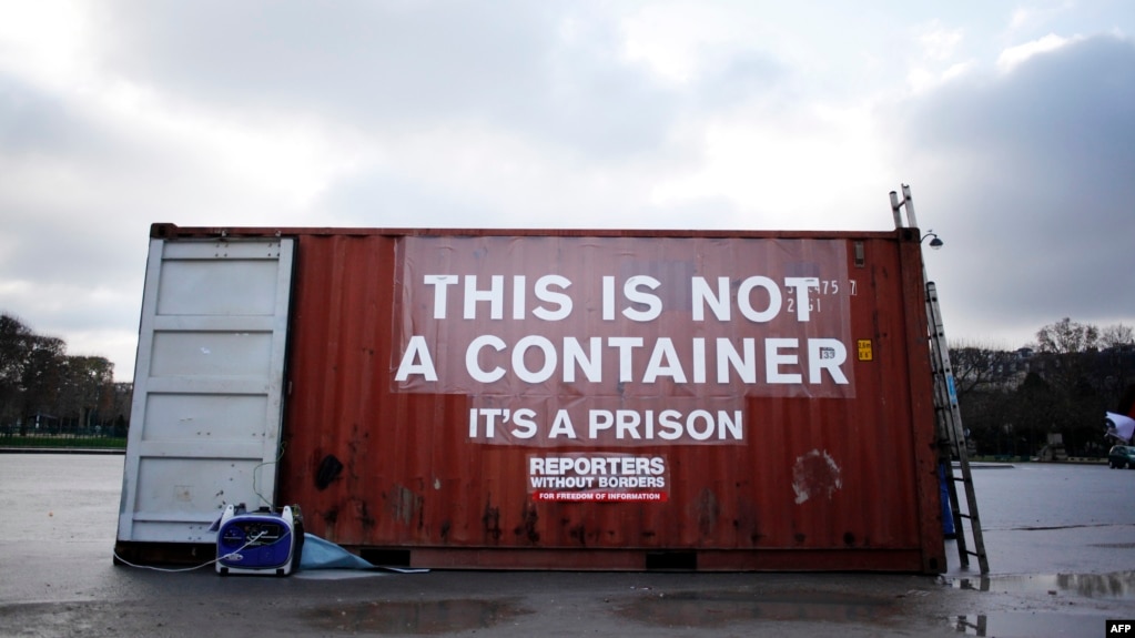 FILE - A shipping container stands in position during a demonstration by the press freedoms organization Reports Sans Frontier (Reporters Without Borders) in Paris, Dec. 16, 2014. Reports from inside Eritrea describe inhumane conditions where prisoners are held in shipping crates in the desert.