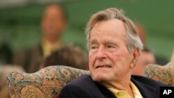 FILE - Former President George H.W. Bush attends a ceremony to unveil a new garden named in his wife's honor, Sept 29, 2011, in Kennebunkport, Maine.