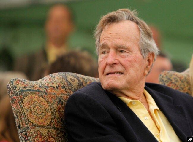 FILE - Former President George H.W. Bush attends a ceremony to unveil a new garden named in his wife's honor, Sept 29, 2011, in Kennebunkport, Maine.