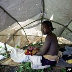 A woman who gave birth while fleeing from attacks by the Lord's Resistance Army (LRA) in the region sits in a makeshift tent near the south-western Southern Sudan town of Yambio (File)