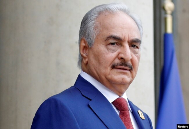 FILE PHOTO: Khalifa Haftar, the military commander who dominates eastern Libya, arrives to attend an international conference on Libya in Paris, May 29, 2018.