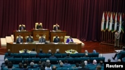 FILE - Libyan Parliament meet to discuss approving new government, in Sirte, Libya March 8, 2021. 
