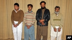 Pakistanis accused of being the facilitators of the deadly attack on a university are presented to the media, in Peshawar, Pakistan, Jan. 23, 2016.