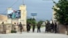 Afghan soldiers stand guard at the gate of a military compound after an attack by gunmen in Mazar-i-Sharif, north of Kabul, Afghanistan, April 21, 2017.