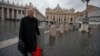 FILE - Cardinal Joseph Zen, of Hong Kong, walks in St. Peter's Square after attending a cardinals' meeting, at the Vatican, March 6, 2013.