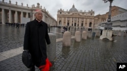 FILE - Cardinal Joseph Zen, of Hong Kong, walks in St. Peter's Square after attending a cardinals' meeting, at the Vatican, March 6, 2013.