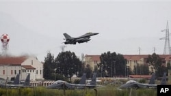 A Danish F-16 aircraft takes off from the NATO airbase in Sigonella, on the southern Italian Sicily island, March 20, 2011