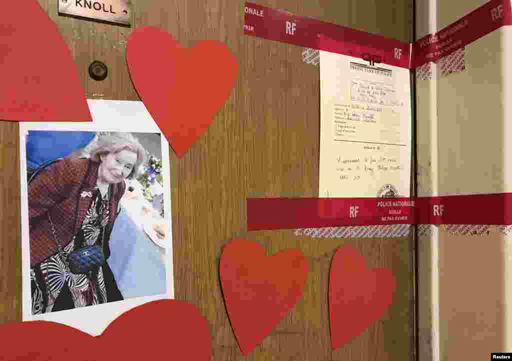 Red tape police seals and a photograph are seen on the front door of the appartment of Mireille Knoll in Paris, France. Mireille Knoll, 85, was found dead on Friday at her apartment in Paris's central 11th district. She had been stabbed multiple times and