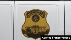 FILE - The seal of the Secret Service Uniformed Division is seen on the side of a vehicle in Washington, D.C., Oct. 2, 2014.
