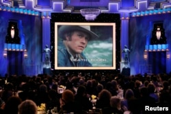 FILE - Heath Ledger is shown on a screen during a memorial to the late actor at the 14th annual Screen Actors Guild Awards in Los Angeles, Jan. 27, 2008.
