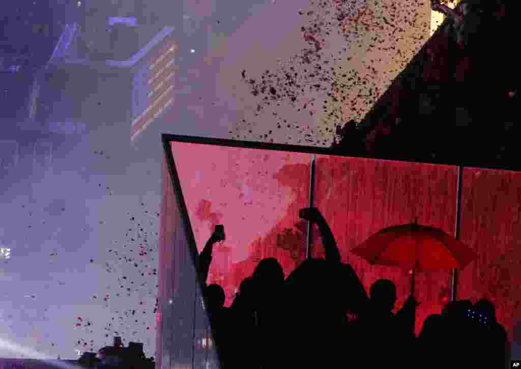 Confetti drops over the crowd as the clock strikes midnight during the New Year's celebration in Times Square as seen from the Marriott Marquis in New York, Jan. 1, 2019.