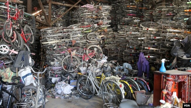 One of Shiek Chhai's three warehouses contains around 5,000 bikes, from street to city to children's two wheelers. (Kiana Duncan/VOA Khmer)