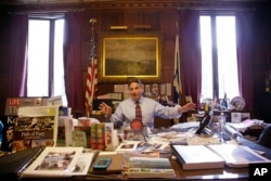 In this June 5, 2014 photo, Springfield Mayor Domenic Sarno sits behind his city hall desk.