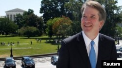 With the U.S. Supreme Court building in the background, Supreme Court nominee judge Brett Kavanaugh arrives prior to meeting with Senate Majority Leader Mitch McConnell on Capitol Hill in Washington, July 10, 2018. 