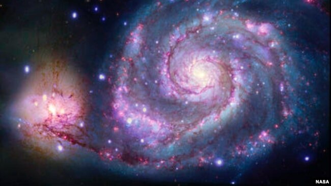 A composite image of M51 with X-rays from Chandra and optical light from NASA's Hubble Space Telescope contains a box that marks the location of the possible planet candidate. (Image Credits: X-ray: NASA/CXC/SAO/R. DiStefano, et al.; Optical: NASA/ESA/STS