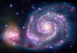 A composite image of M51 with X-rays from Chandra and optical light from NASA's Hubble Space Telescope contains a box that marks the location of the possible planet candidate. (Image Credits: X-ray: NASA/CXC/SAO/R. DiStefano, et al.; Optical: NASA/ESA/STS