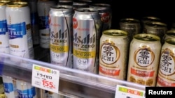 Various cans of alcohol-free beers, including those from Asahi, Kirin and Suntory, are displayed on a supermarket shelf in Tokyo, Japan March 9, 2021. (REUTERS/Ritsuko Ando)