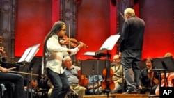 Haitian-American violinist Daniel Bernard Roumain rehearsing with Maestro Bramwell Tovey and the Vancouver Symphony Orchestra on February 14, 2010.