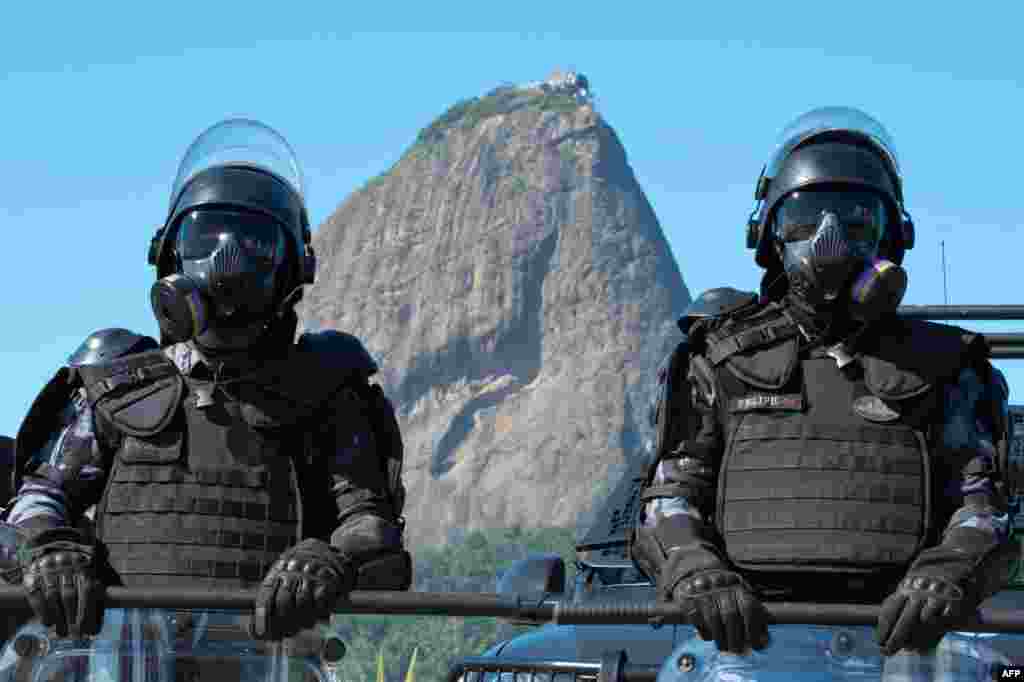 Policemen of the &quot;Choque&quot; special unit pose during the presentation of security forces for the upcoming FIFA World Cup, in Flamengo beach in Rio de Janeiro.