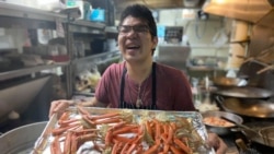 Yuttasak Tanawan, "Chef Tang" prepares King Crab Legs during his live show on social media in Washington,DC. Oct 2020.