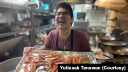 Yuttasak Tanawan, "Chef Tang" prepares King Crab Legs during his live show on social media in Washington,DC. Oct 2020.