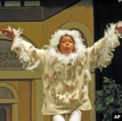 Piedmont High student Malaya Ibabao performs as a common barn owl.