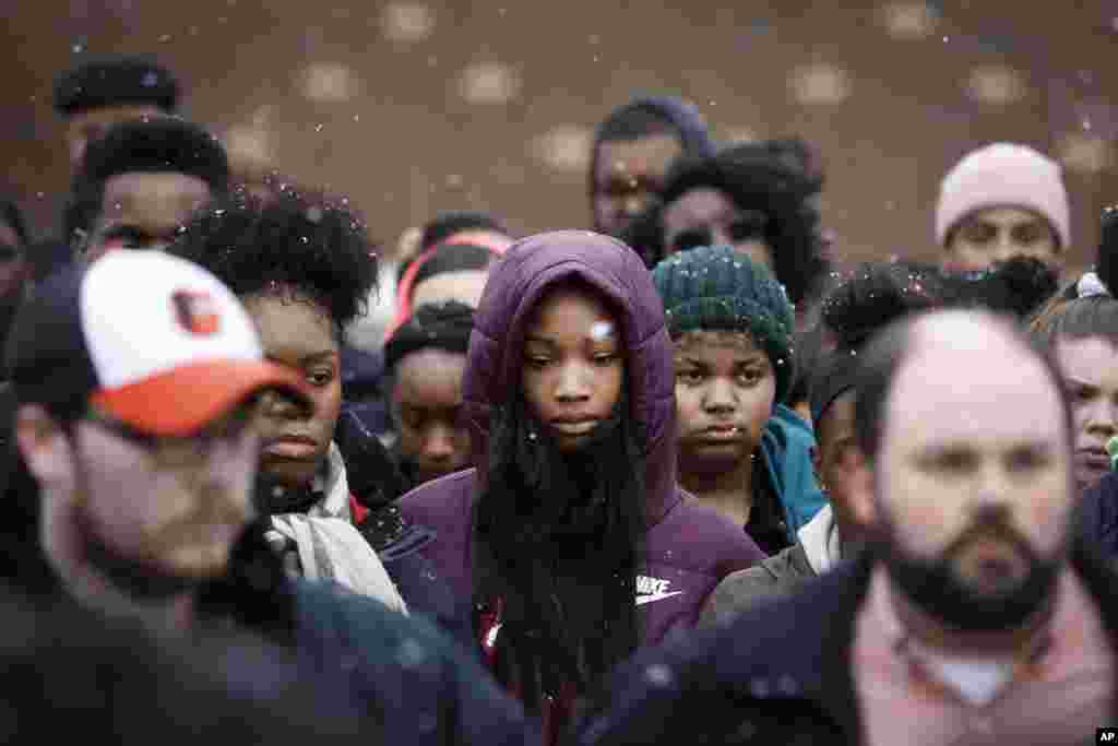 Students gather on their soccer field during a 17-minute walkout protest at the Stivers School for the Arts in Dayton, Ohio, March 14, 2018.