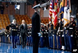 Army Col. Jason T. Garkey escorts President Barack Obama as he inspects the Armed Forces Honor Guard during an Armed Forces Full Honor Farewell Review for the president, Jan. 4, 2017, at Conmy Hall, Joint Base Myer-Henderson Hall, Virginia.