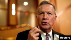 Ohio Governor and former presidential candidate John Kasich speaks to the press in Concord, N.H., Nov.15, 2018.