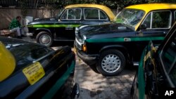 Hindustan Ambassadors taxis are parked outside a hotel in New Delhi, India, Feb. 13, 2017. 