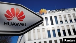 FILE - The logo of Huawei Technologies is pictured in front of the German headquarters of the Chinese telecommunications giant in Duesseldorf, Germany, Feb. 18, 2019. 