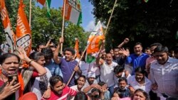 Activists of Congress party's youth wing shout slogans in New Delhi, India, Oct. 4, 2021.