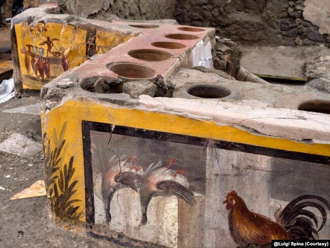 This image provided by the Pompeii Archeological park press office shows the thermopolium in the Pompeii archeological park, near Naples, Italy. @Luigi Spina (Courtesy)