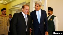 U.S. Secretary of State John Kerry walks into a meeting with Pakistan's Prime Minister Nawaz Sharif (L) in Islamabad August 1, 2013. Kerry met with leaders of Pakistan's newly elected civilian government on Thursday. REUTERS/Jason Reed (PAKISTAN - Tags: