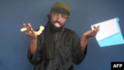 This screen grab image taken on February 18, 2015 from a video made available by Islamist group Boko Haram shows Boko Haram leader Abubakar Shekau making a statement at an undisclosed location. 