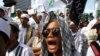 FILE - Members of the militant Islamic Defenders Front (FPI) shout slogan during a demontration in Jakarta, Indonesia.