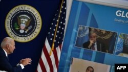 US President Joe Biden convenes a virtual COVID-19 Summit on the sidelines of the UN General Assembly, on Sept. 22, 2021, in the South Court Auditorium of the White House in Washington.