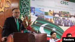 FILE - Ahsan Iqbal, then Pakistan's minister for planning and development, speaks during the launch ceremony of the China-Pakistan Economic Corridor (CPEC) long-term cooperation plan, in Islamabad, Pakistan, Dec. 18, 2017. There is now talk of expanding the project into Afghanistan.