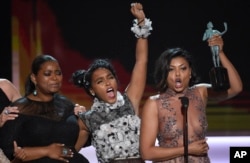 Octavia Spencer, from left, Janelle Monae, and Taraji P. Henson accept the award for outstanding performance by a cast in a motion picture for "Hidden Figures" at the 23rd annual Screen Actors Guild Awards, Jan. 29, 2017, in Los Angeles.