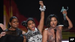 FILE - Octavia Spencer, from left, Janelle Monae, Taraji P. Henson, and Kirsten Dunst accept the award for outstanding performance by a cast in a motion picture for "Hidden Figures" at the 23rd annual Screen Actors Guild Awards, Jan. 29, 2017, in Los Angeles.
